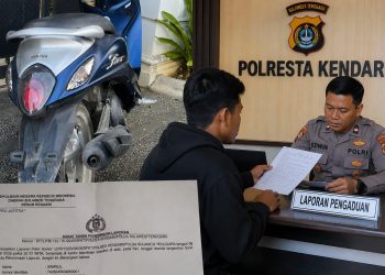 Motor yang diduga digelapkan beserta laporan resmi kepolisian