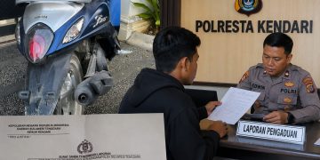 Motor yang diduga digelapkan beserta laporan resmi kepolisian